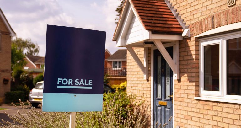 A For Sale sign outside a house