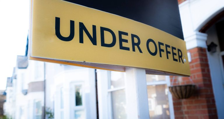 Under offer sign outside a house